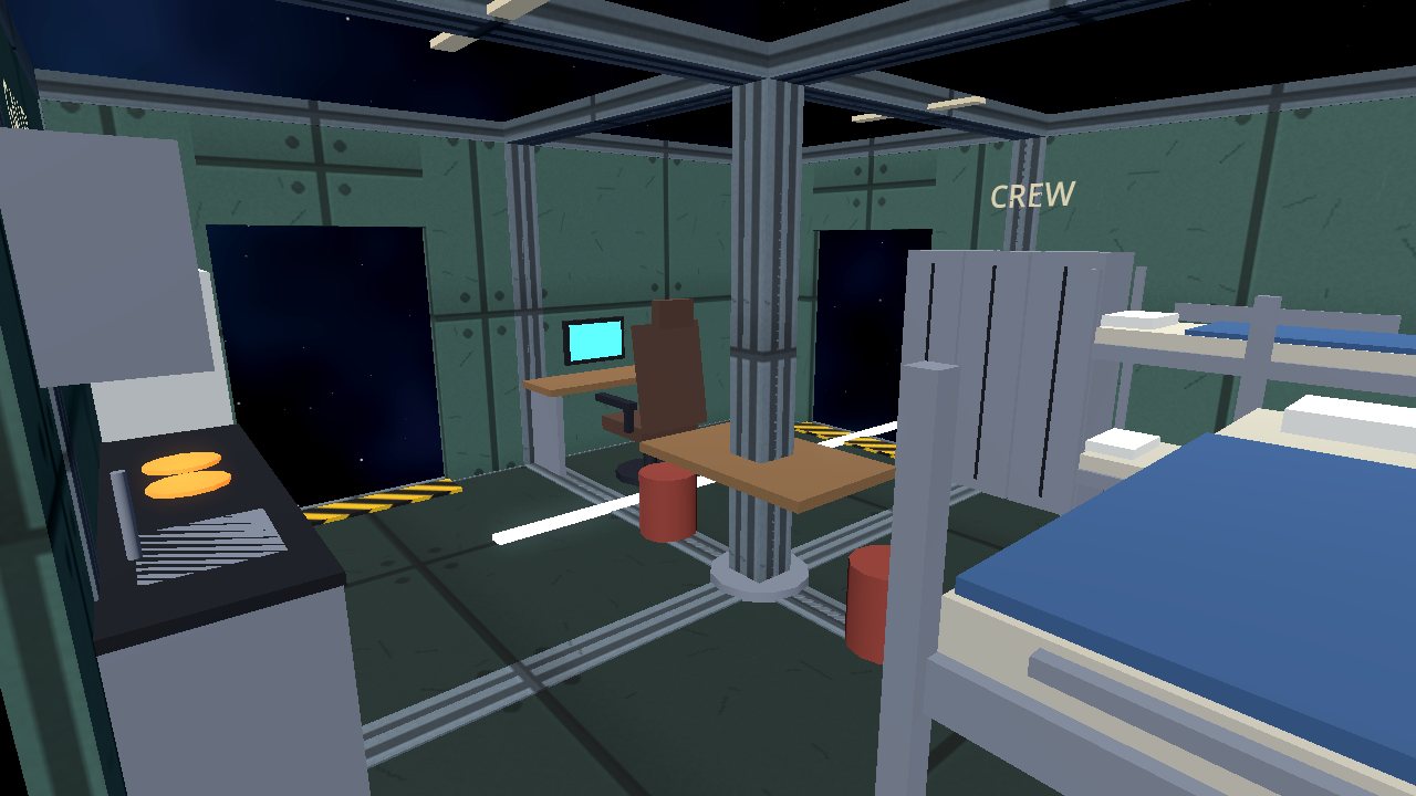Crew quarters seen from the galley end, with a desk, a table and a bunk.